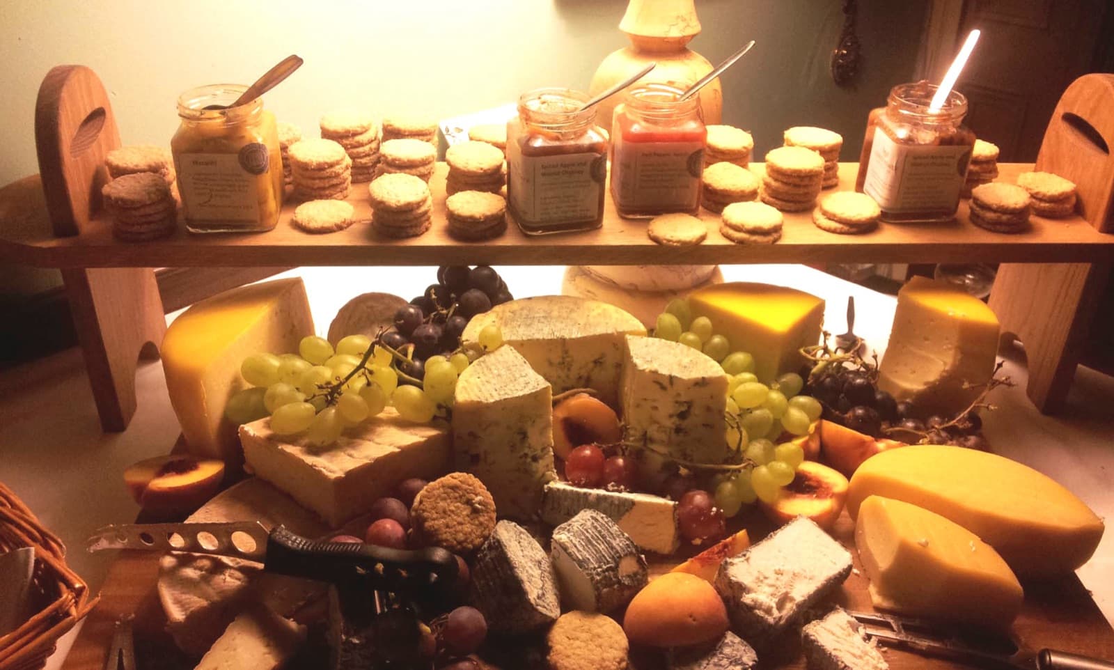 Wedding cheese board at Temple House, with wedges of cheese served with grapes, relish and biscuits