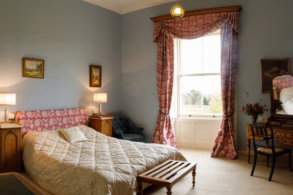 An elegant bedroom at Temple House — two-room midweek B&B stays