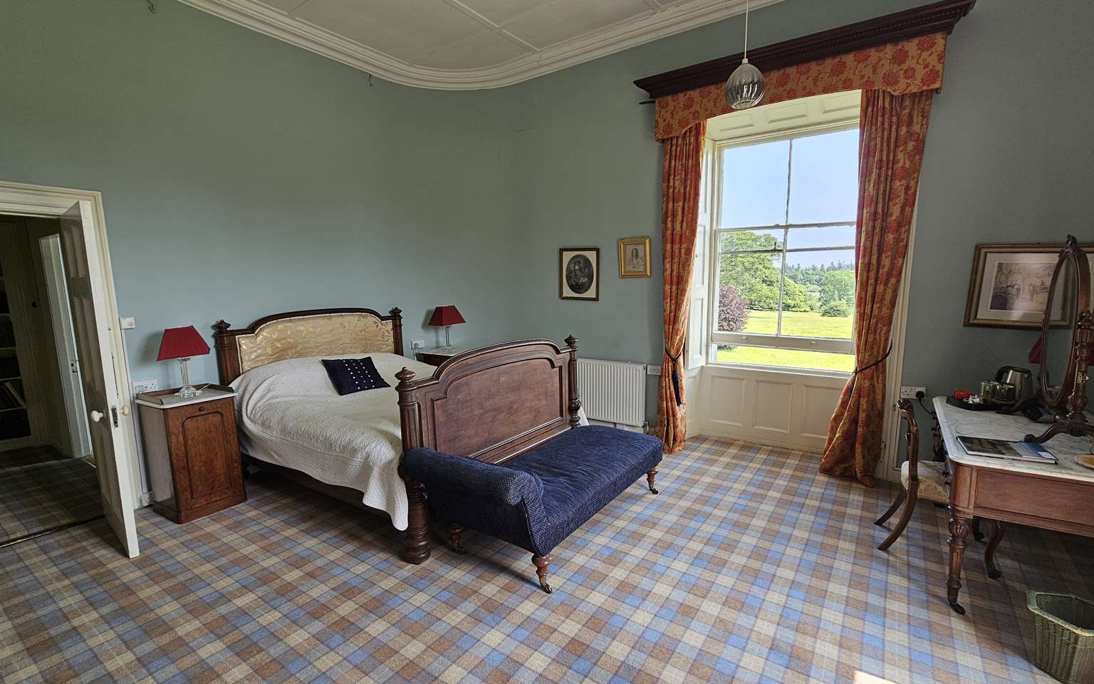 A lake view bedroom at Temple House with views to the castle ruins