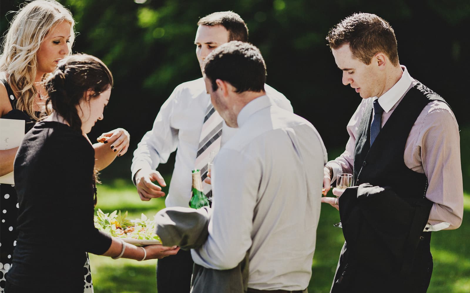 Wedding guests enjoying cocktails on the garden terrace at Temple House