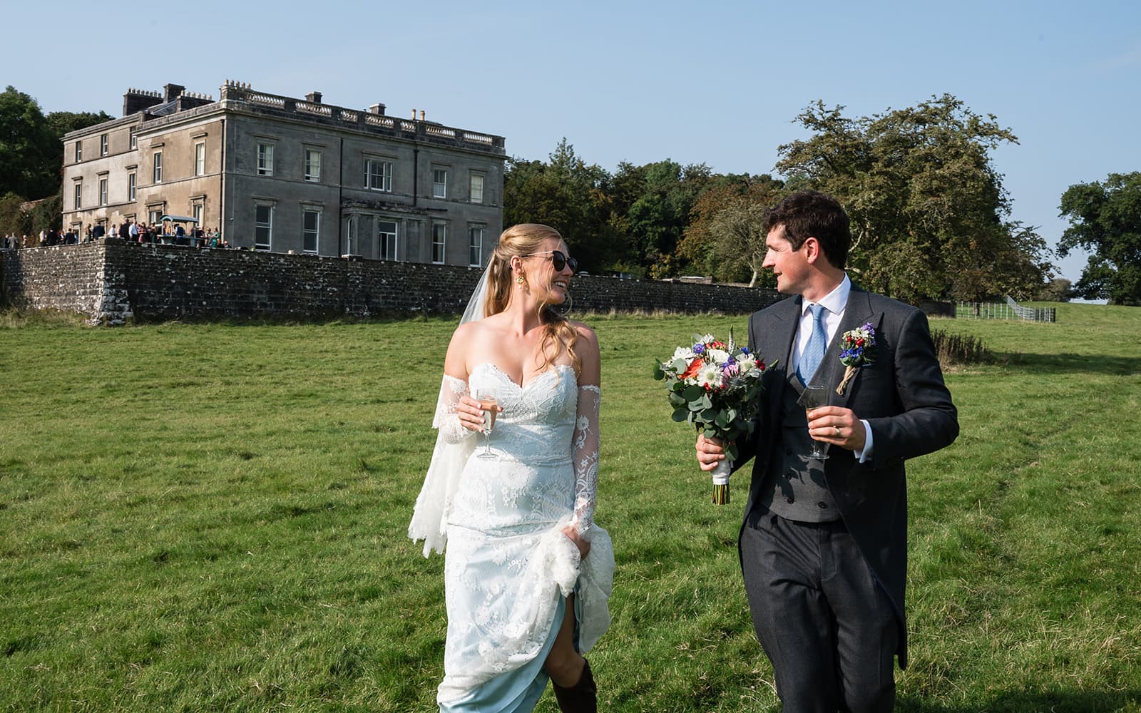 Bride and groom with Temple House as their backdrop