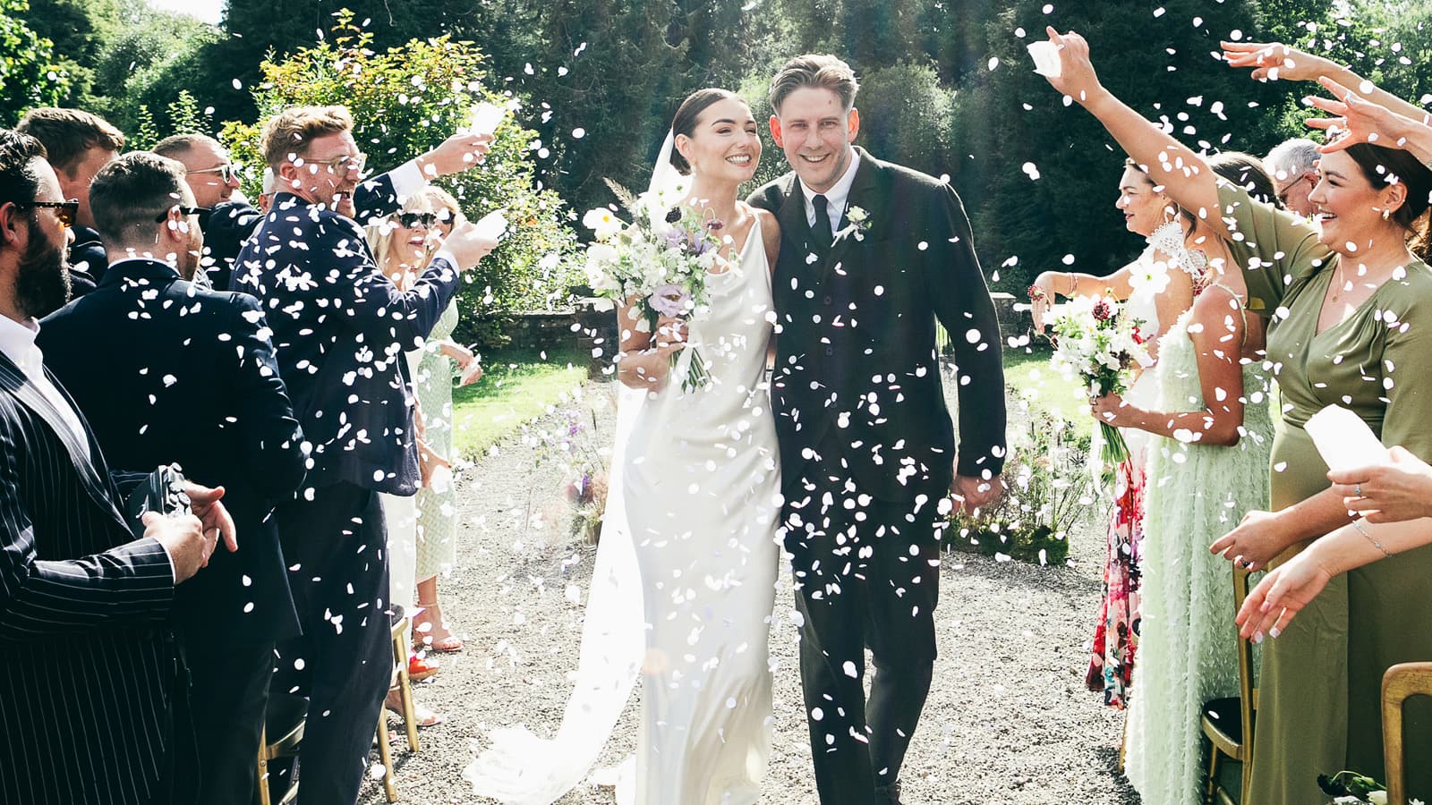 Confetti over a garden wedding ceremony at Temple House