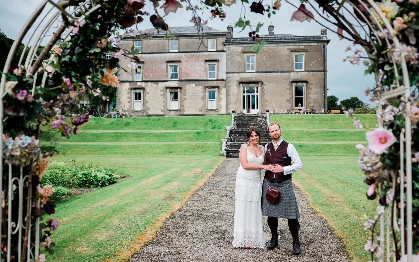 Wedding couple with flowers at Temple House