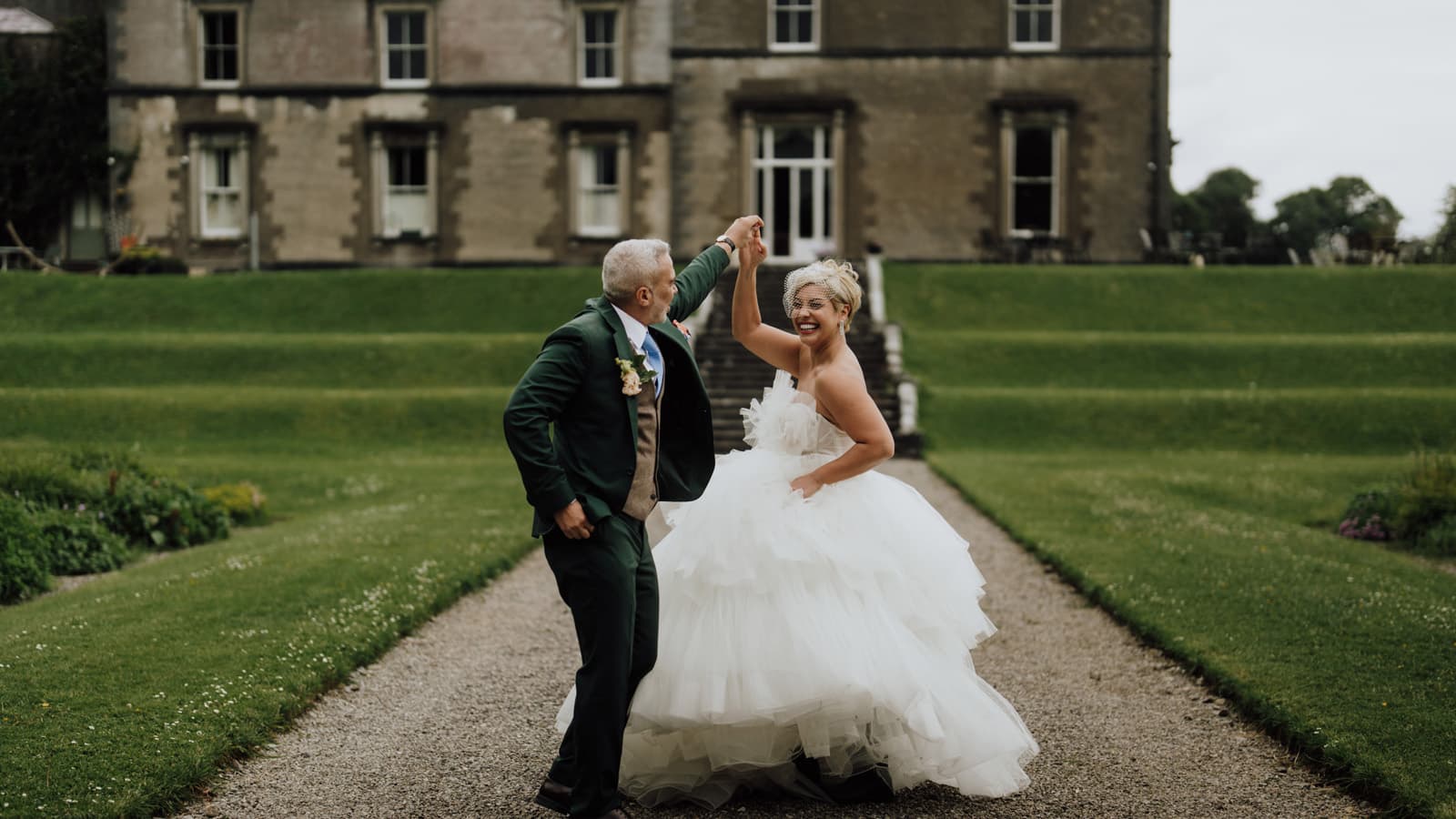 Wedding couple front of house at Temple House
