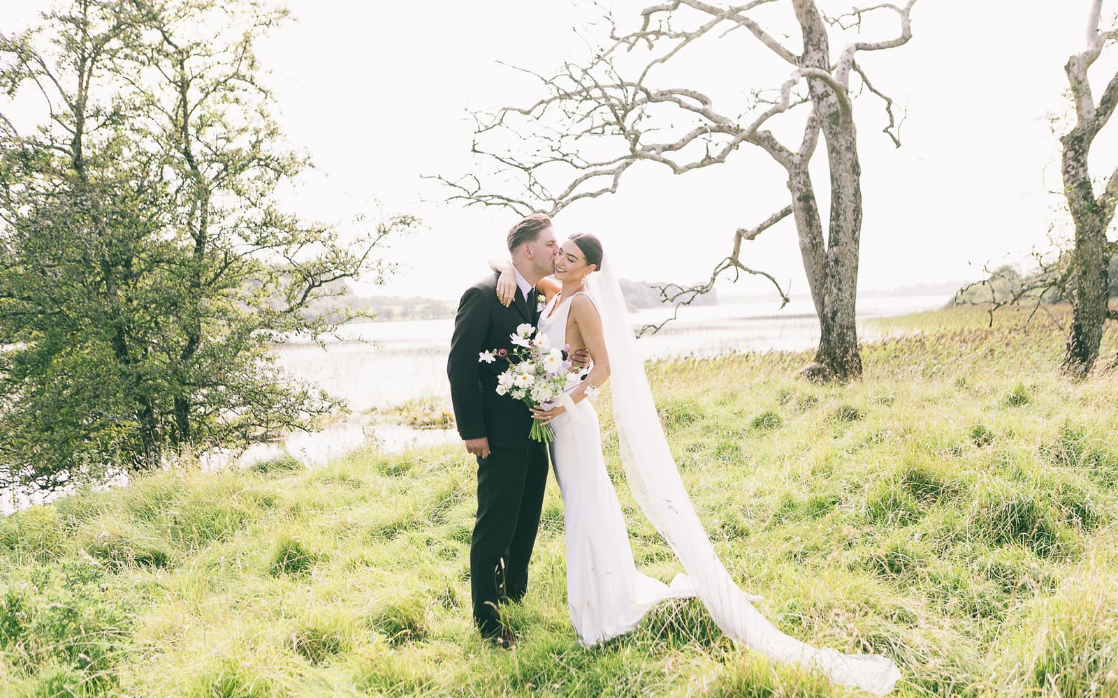 Wedding couple beside the lake at Temple House